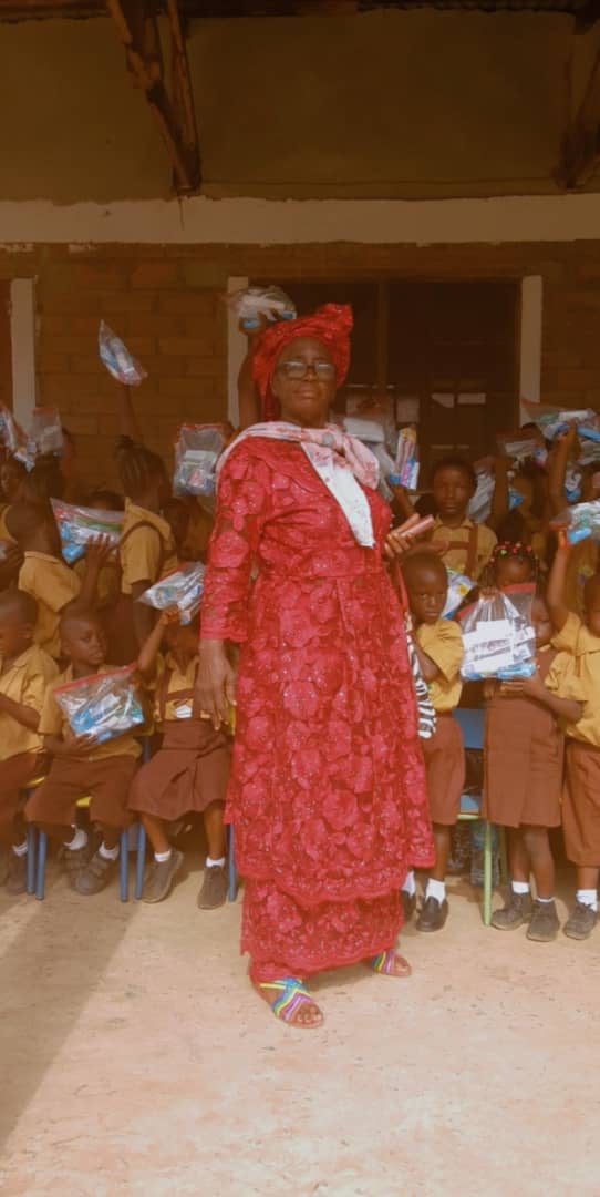 Pupils in Sierra Leone holding their packages